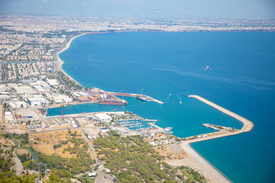 High angle view of sea and buildings in city