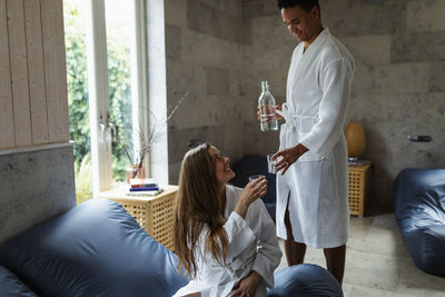 Couple relaxing together in living room