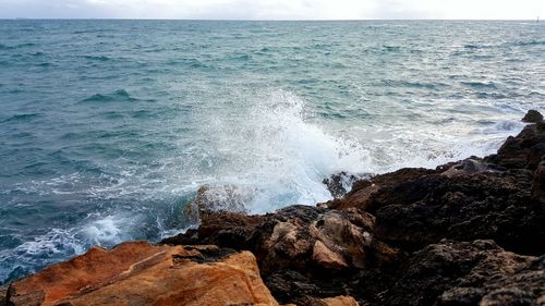 Waves splashing on rocks