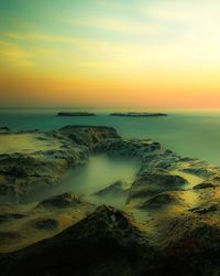 Scenic view of sea against sky during sunset