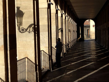 Man standing on colonnade