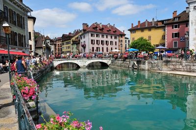 Arch bridge over river in city