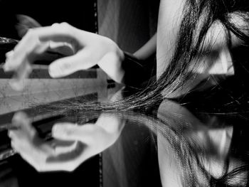 Close-up of woman holding cigarette