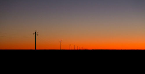 Silhouette of tree against clear sky at sunset