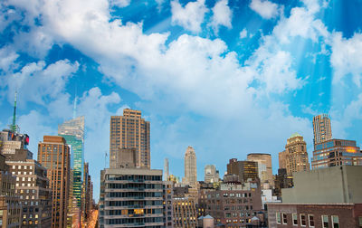 Panoramic view of buildings against blue sky