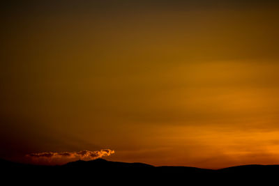 Scenic view of mountains at sunset