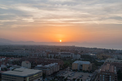 High angle view of cityscape against sky during sunset