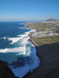 High angle view of beach against blue sky