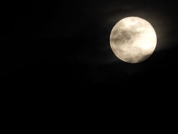 Low angle view of moon against sky at night