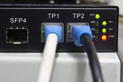 Close-up network equipment in server room and ethernet utp cat6 installed in the rack.