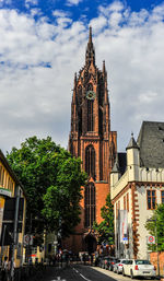 Low angle view of building against sky in city