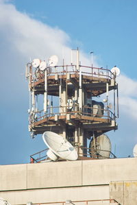 Low angle view of repeater tower against sky