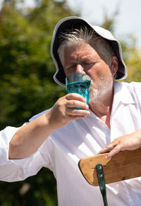 Close-up of man drinking water