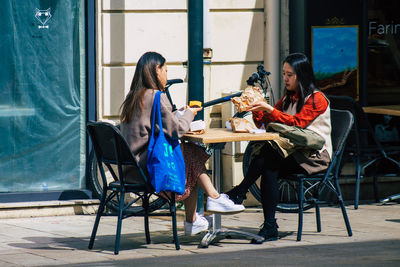 Women sitting on table