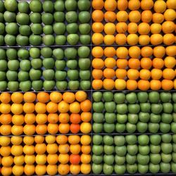 Full frame shot of granny smith apples and honeydew melons at market