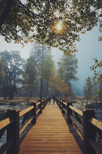 Pier over lake against sky