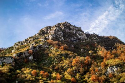 Low angle view of rocks against sky