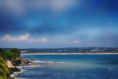 Scenic view of sea against cloudy sky