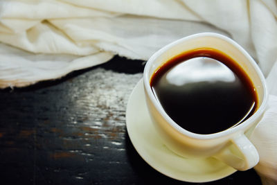 High angle view of coffee cup on table