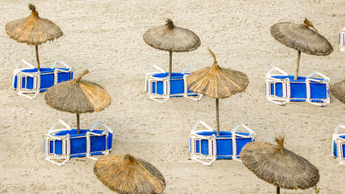 Lounge chairs and tables at beach