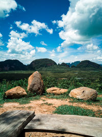 Scenic view of rocks on field against sky