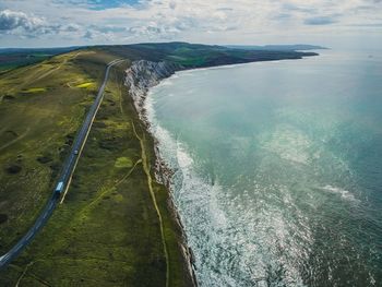 Aerial view of landscape and sea against sky