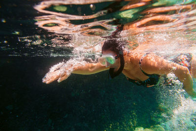 Woman snorkeling in sea