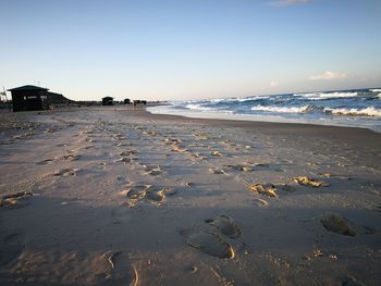 Scenic view of beach against clear sky