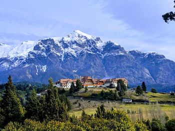 Scenic view of tree and mountains against sky