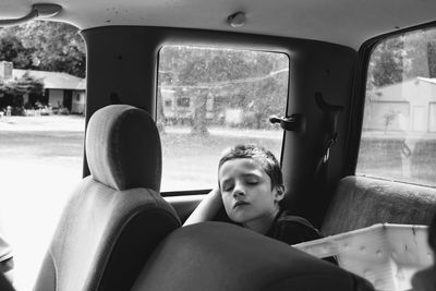 Portrait of teenage boy sitting in car