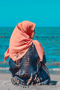 Rear view of woman on beach