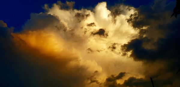 Low angle view of dramatic sky during sunset