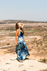 Young woman standing on a land