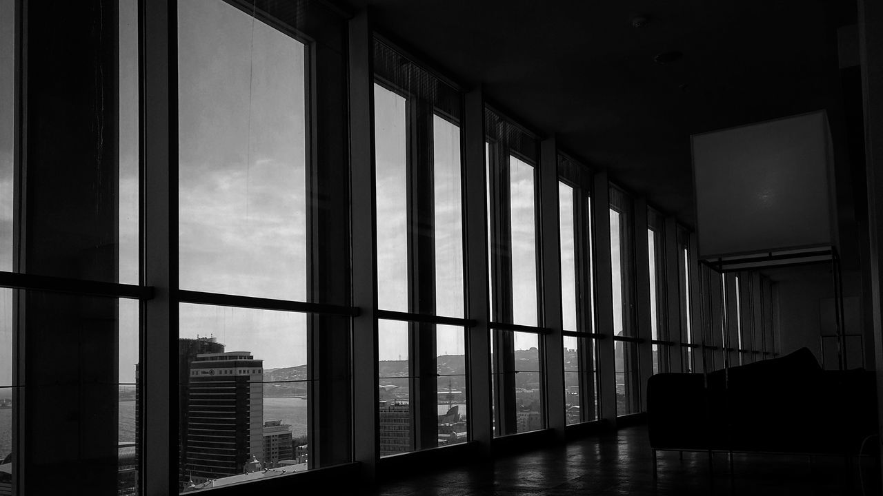 window, architecture, glass - material, indoors, built structure, building, transparent, no people, day, sky, home interior, absence, nature, city, domestic room, cloud - sky, furniture, modern, office building exterior, apartment