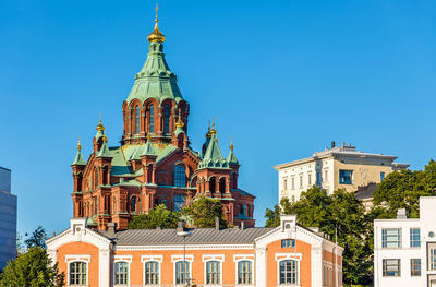 Low angle view of buildings against blue sky