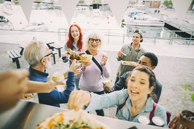 High angle view of people sitting on table