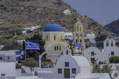 Santorini, greece, may 4, 2024. oia. facade of the orthodox church, agios giorgios with a greek flag