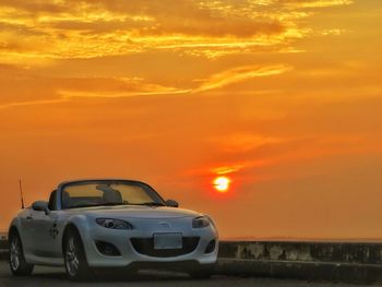 View of car against sky during sunset