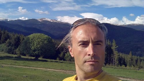 Portrait of man against mountains