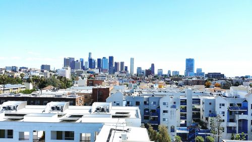 High angle view of buildings against clear sky