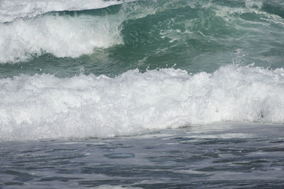 Close-up of wave splashing on sea