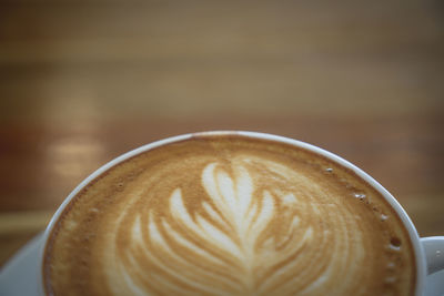 Close-up of cappuccino on table