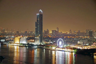 Illuminated buildings in city at night