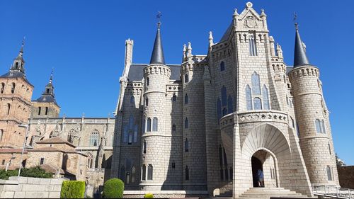 Low angle view of building against blue sky