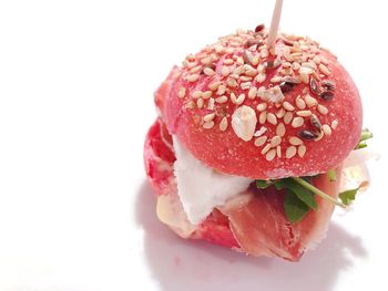Close-up of strawberry cake against white background