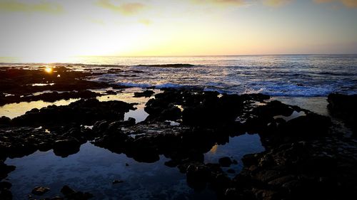 Scenic view of sea at sunset