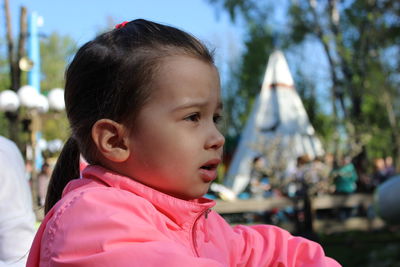 Close-up portrait of a girl looking away