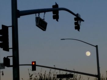 Low angle view of street light against sky