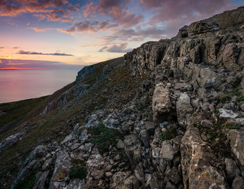 Scenic view of rocky mountains against sky during sunset