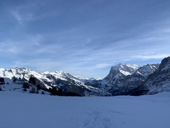 Scenic view of snowcapped mountains against sky